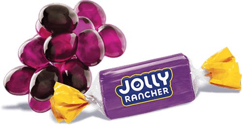 jolly rancher original flavors hard candy beside a cluster of grapes