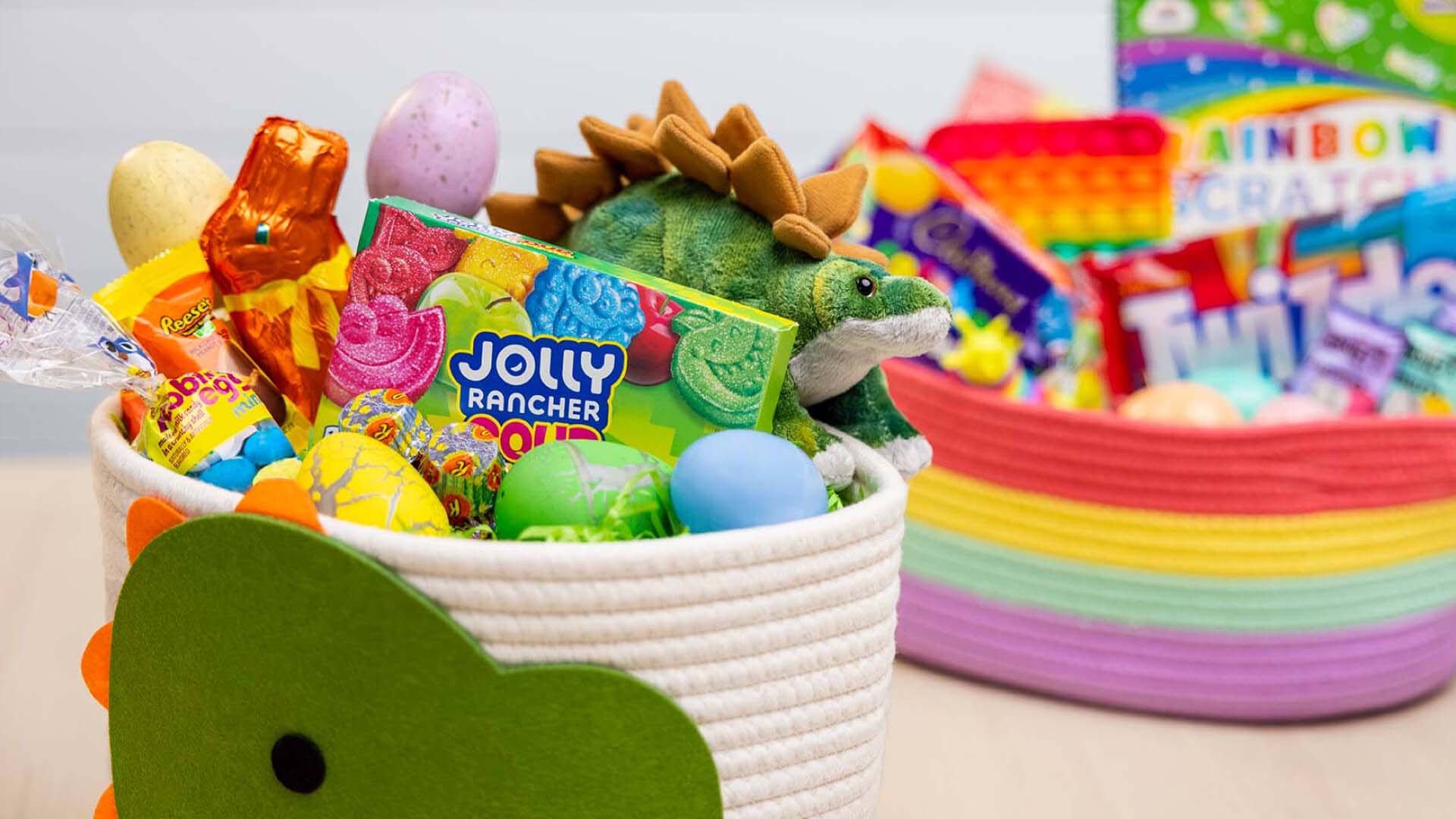 themed baskets filled with hersheys candies, toys, and easter eggs