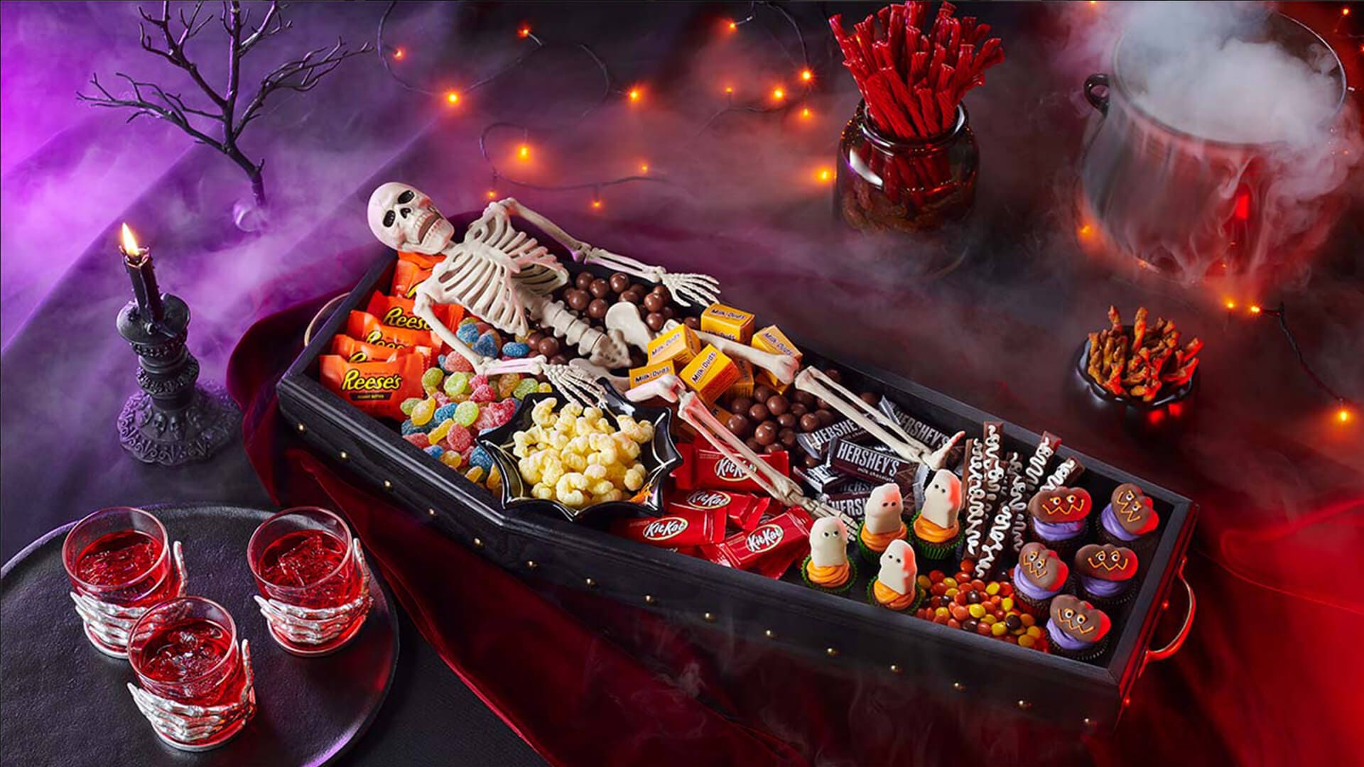 halloween themed coffin candy dish filled with hersheys candies