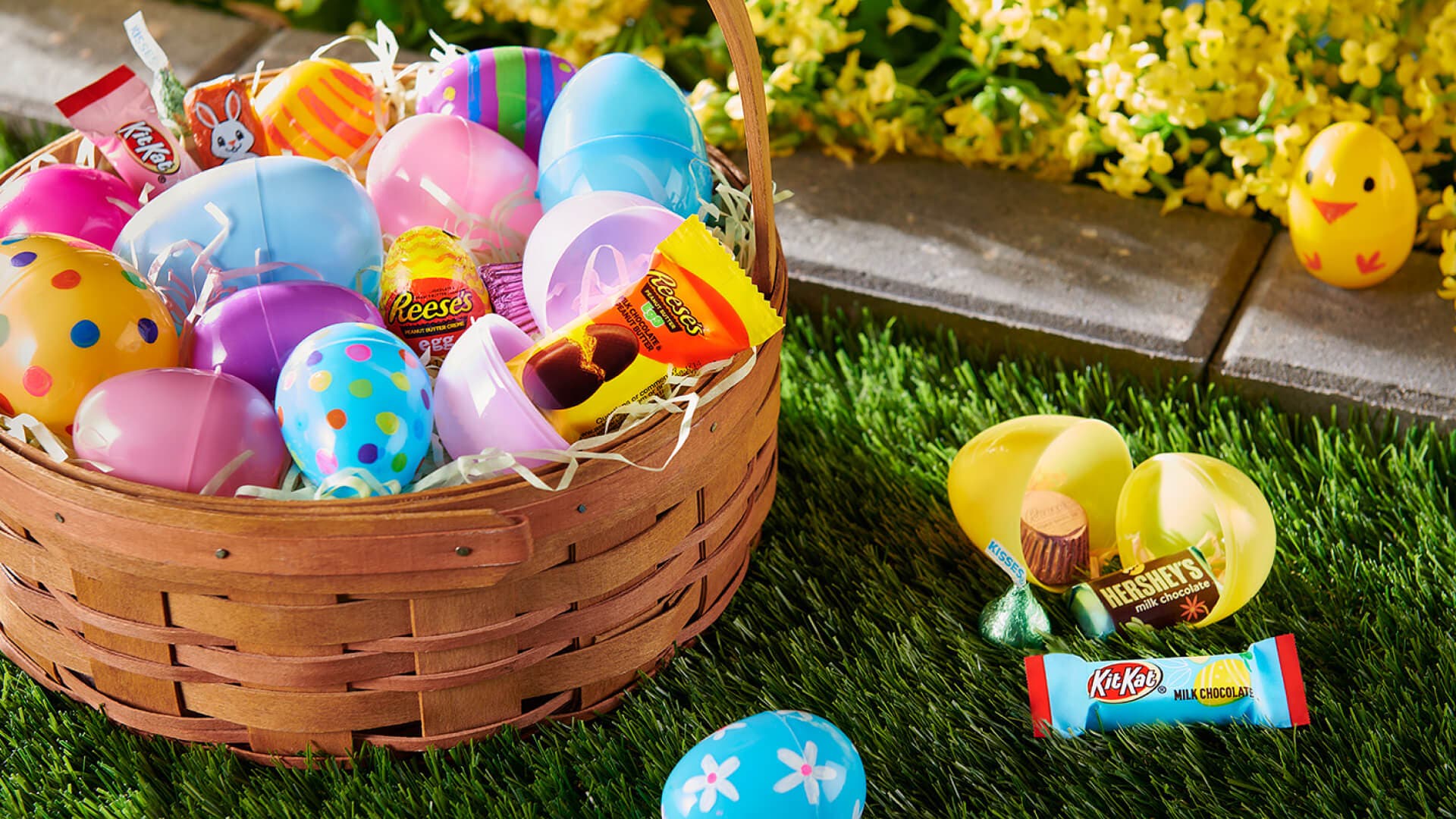 plastic easter eggs and an easter basket filled with hersheys chocolate candies