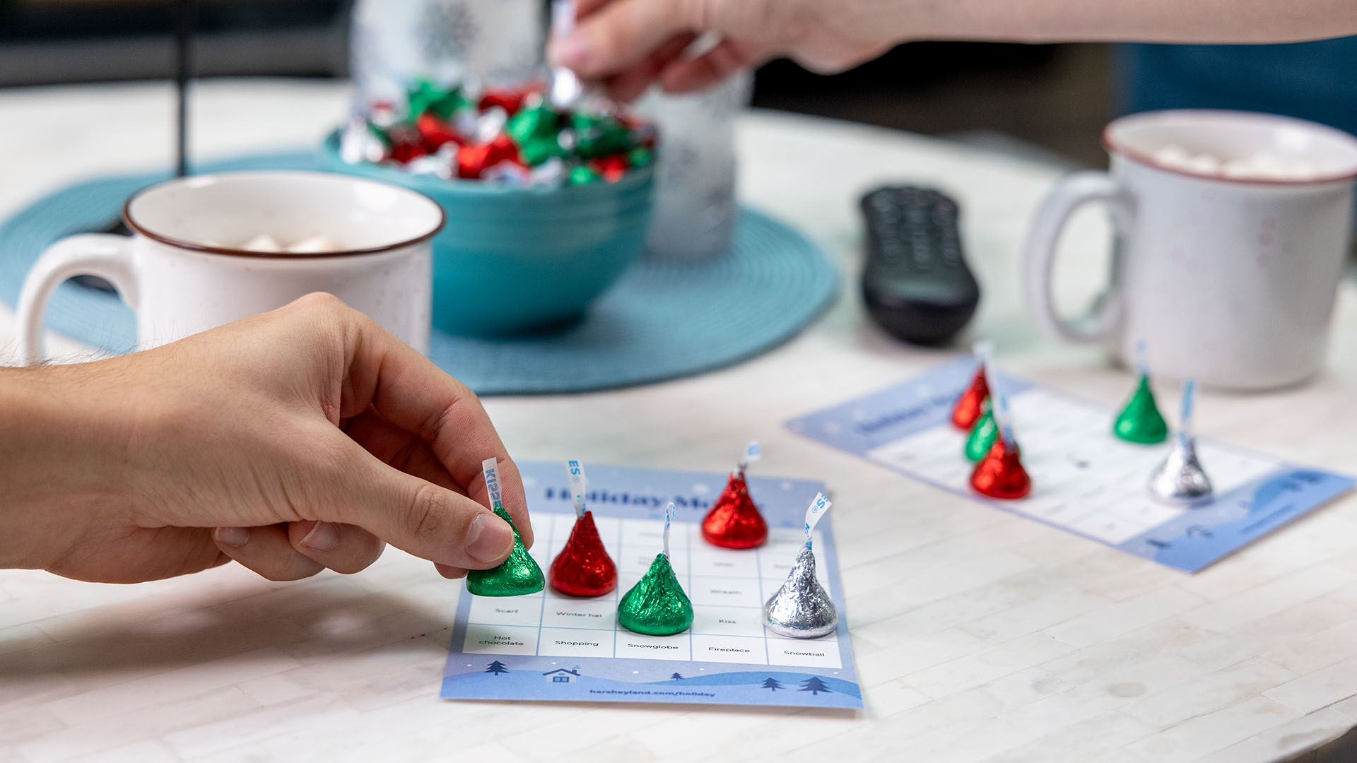 holiday movie bingo cards with hersheys kisses used as game pieces