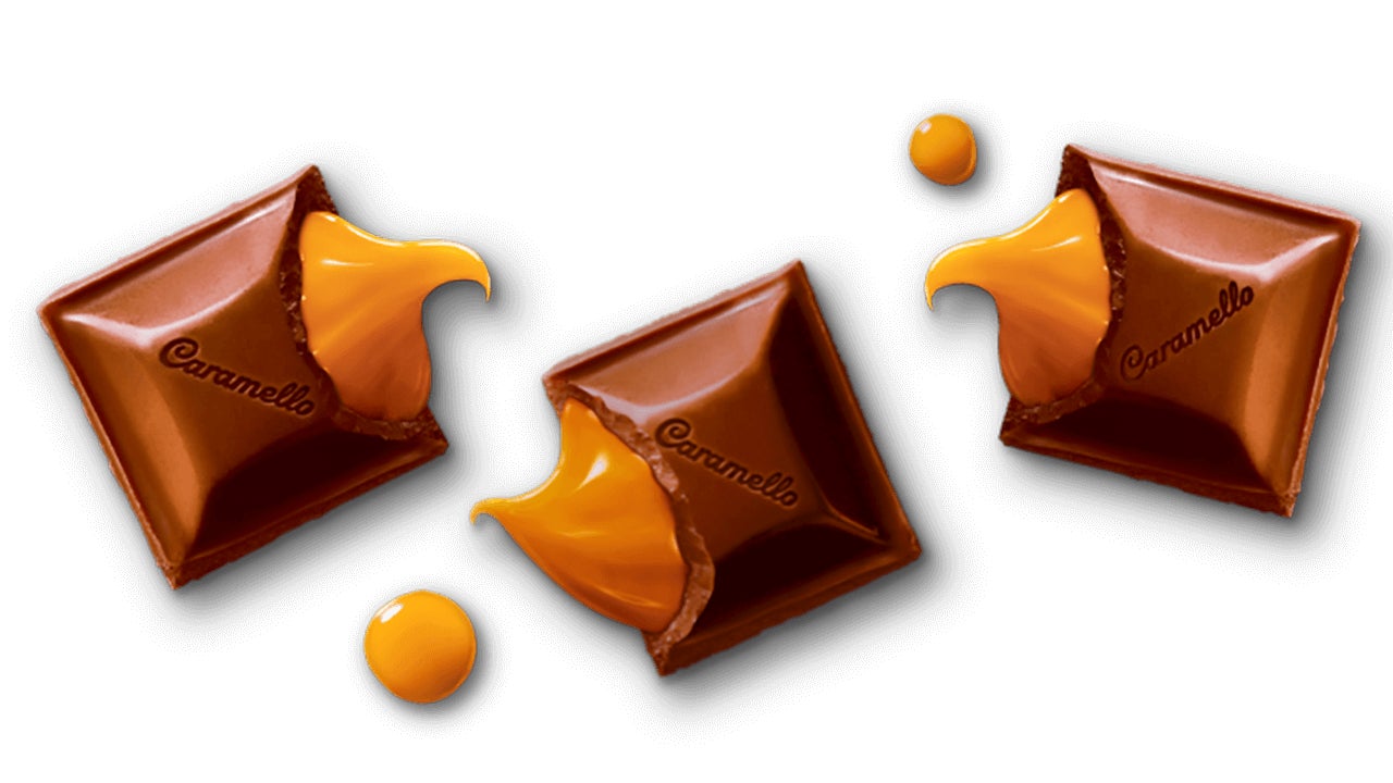 cadbury caramello milk chocolate squares cracked open with caramel pouring out