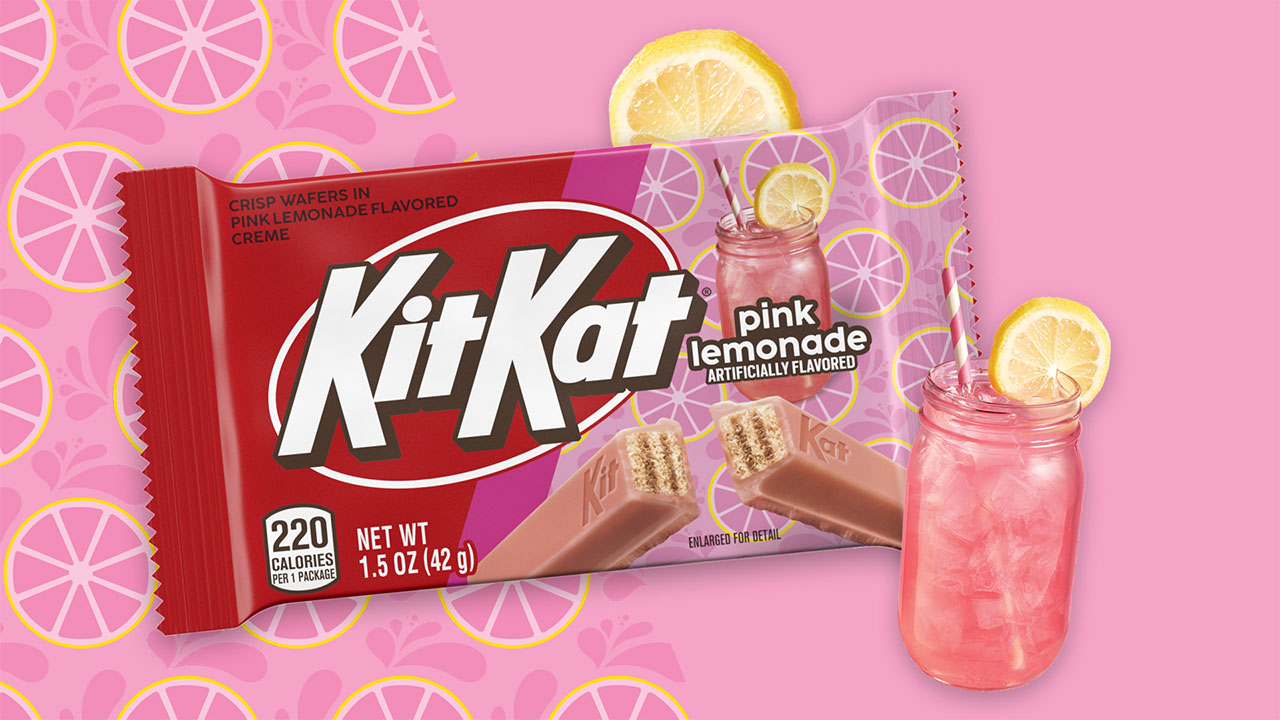 kit kat pink lemonade cany bar beside lemon slices and glass of pink lemonade