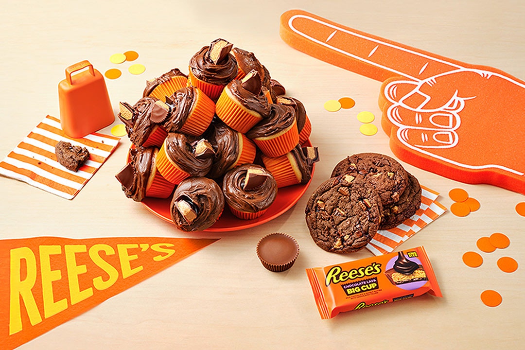 table featuring an assortment of reeses game day recipes, products, and sports party favors