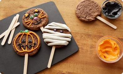 decorated Halloween cookies on a stick