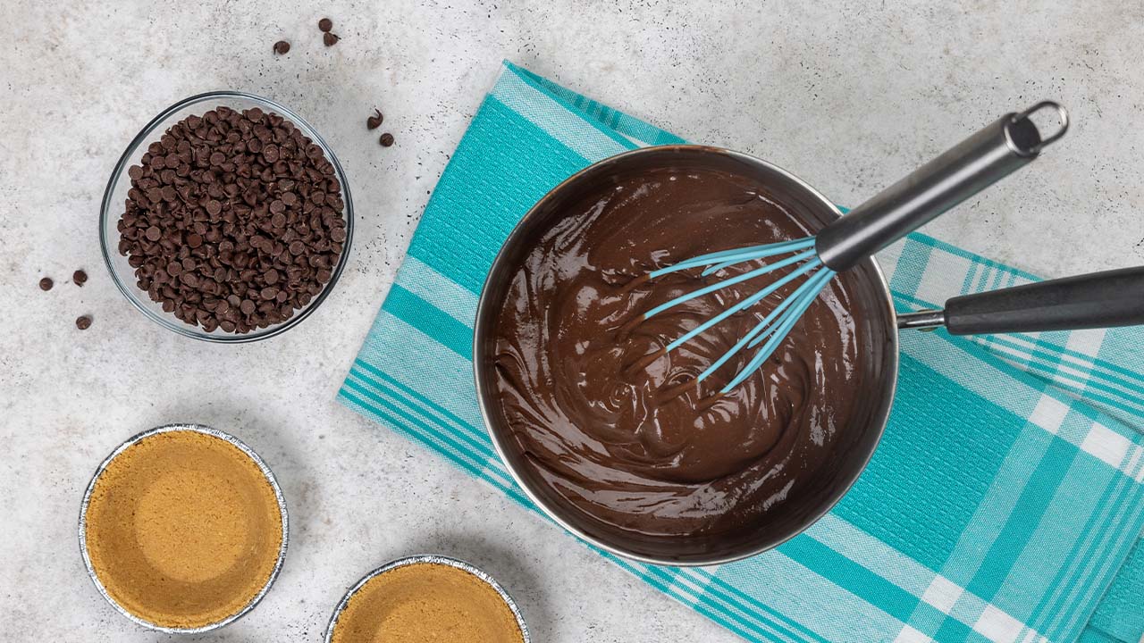 chocolate chips being melted in saucepan