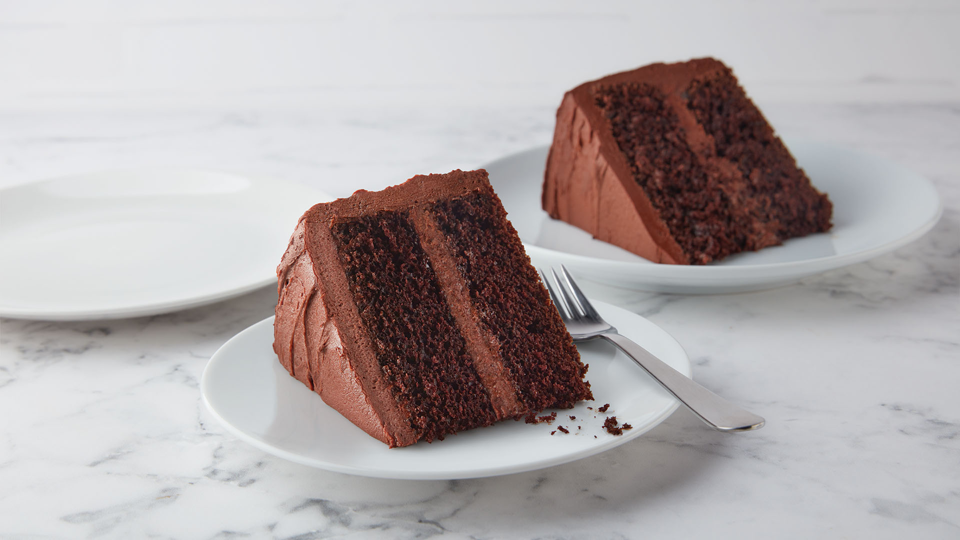 serving dishes topped with slices of hersheys perfectly chocolate cake