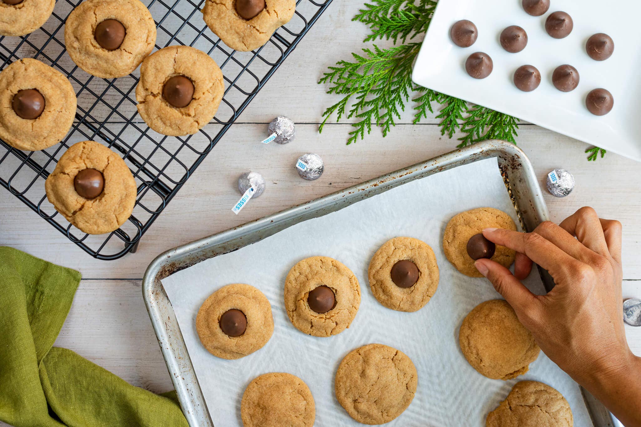 cookies being topped with hersheys kisses