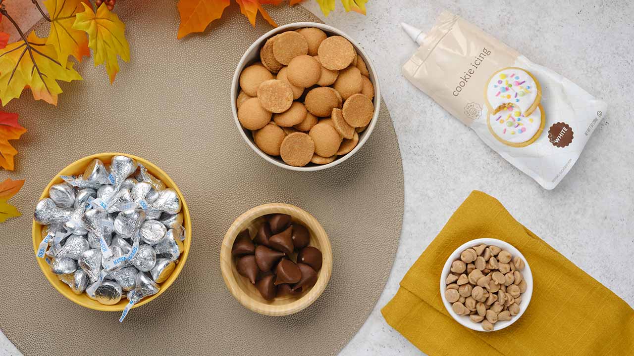 countertop filled with bowls of recipe ingredients and hersheys candy