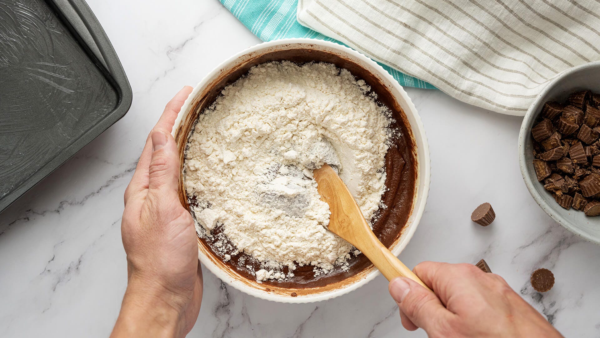 adding dry ingredients to cocoa mixture