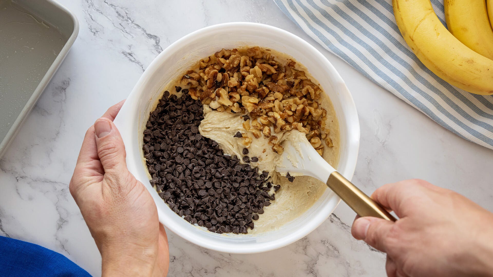 stirring in chocolate chips and walnuts