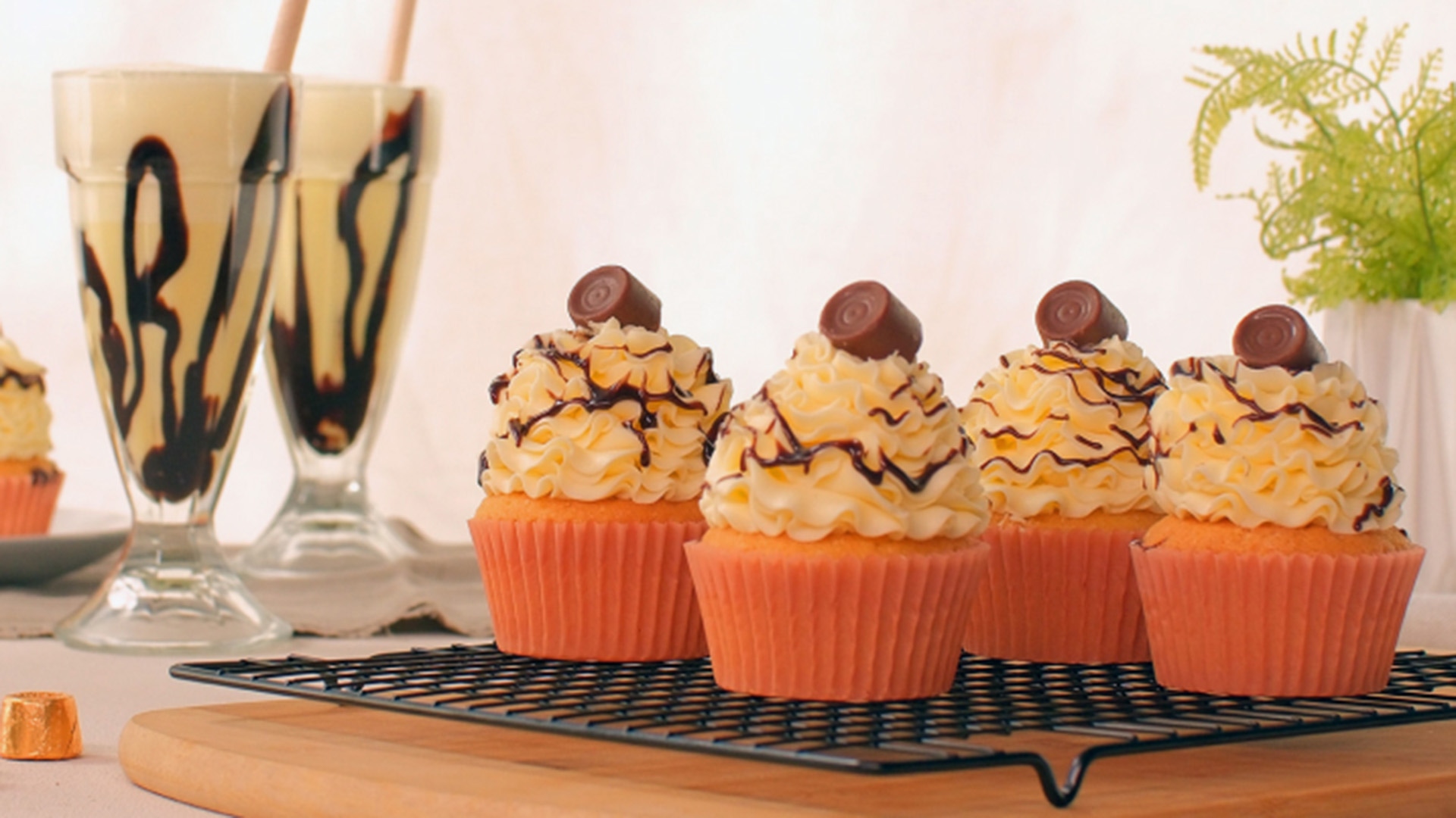 batch of rolo filled vanilla cupcakes cooling on wire rack