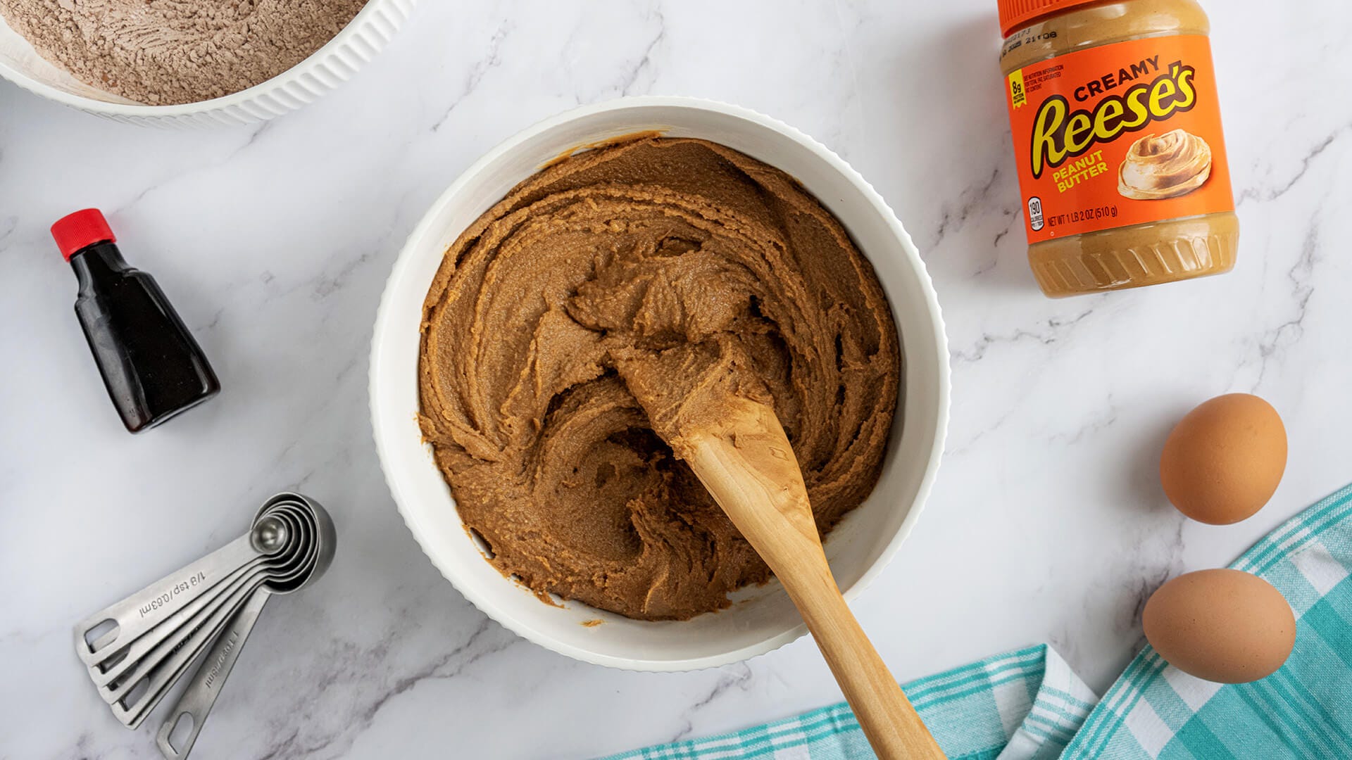 mixing in peanut butter, butter and brown sugar