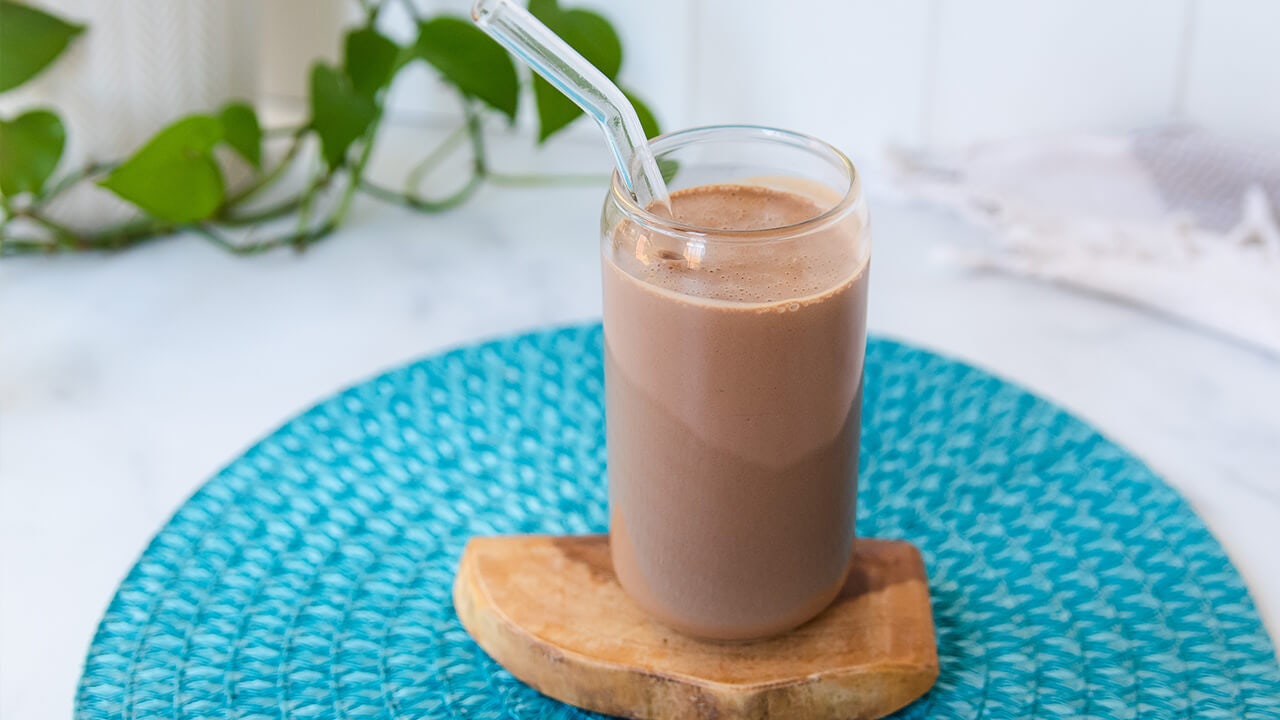 chocolate peanut butter protein shake in glass