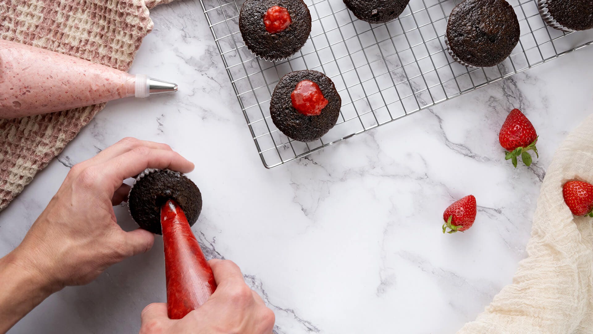 filling cupcakes with strawberry filling