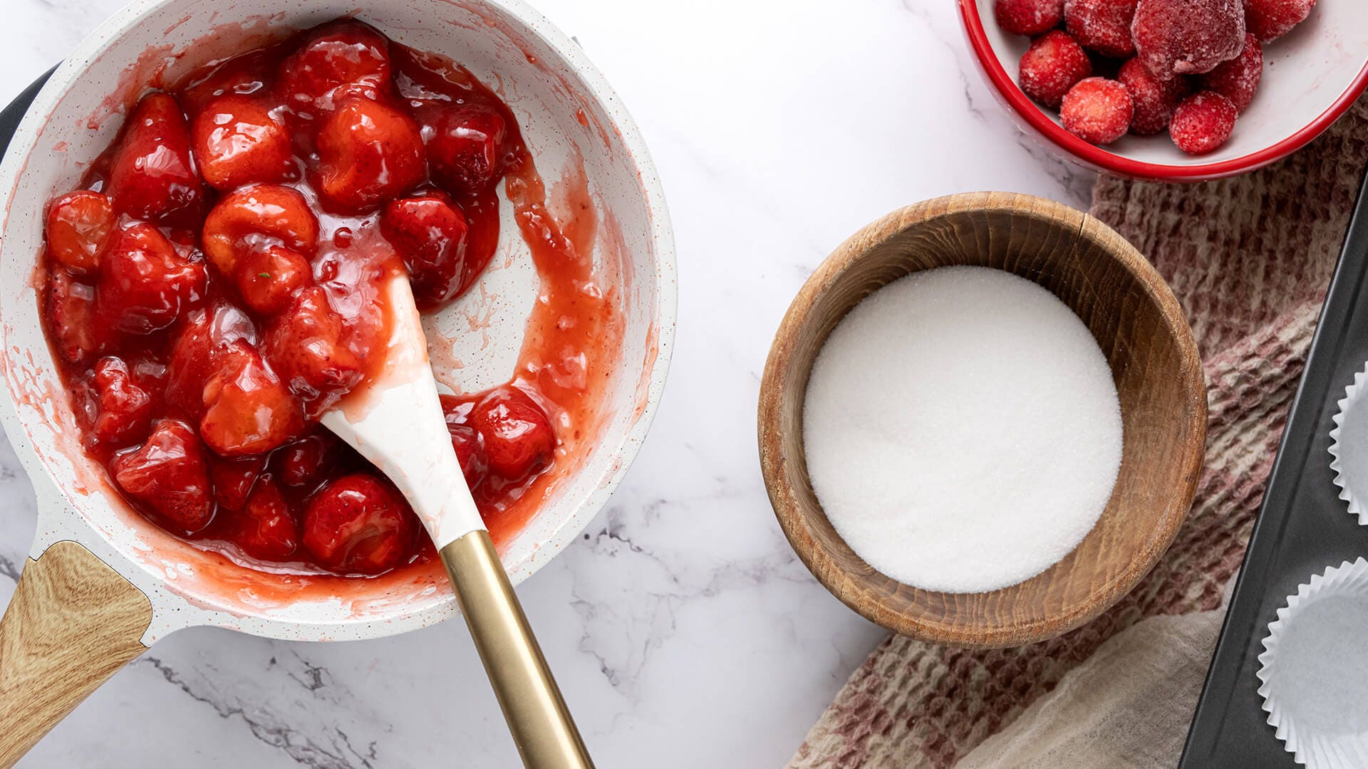 strawberries and sugar cooking over medium heat