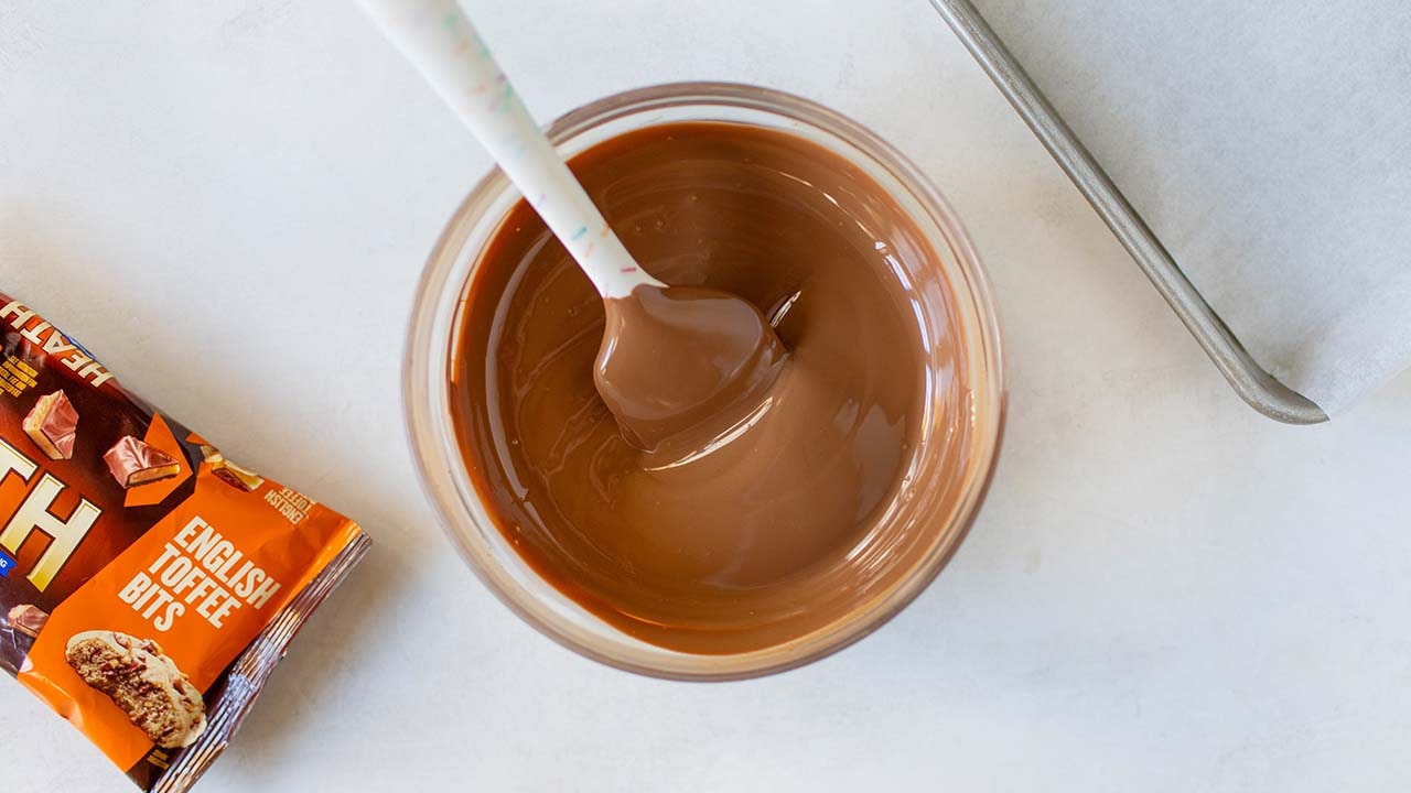 glass bowl filled with melted chocolate