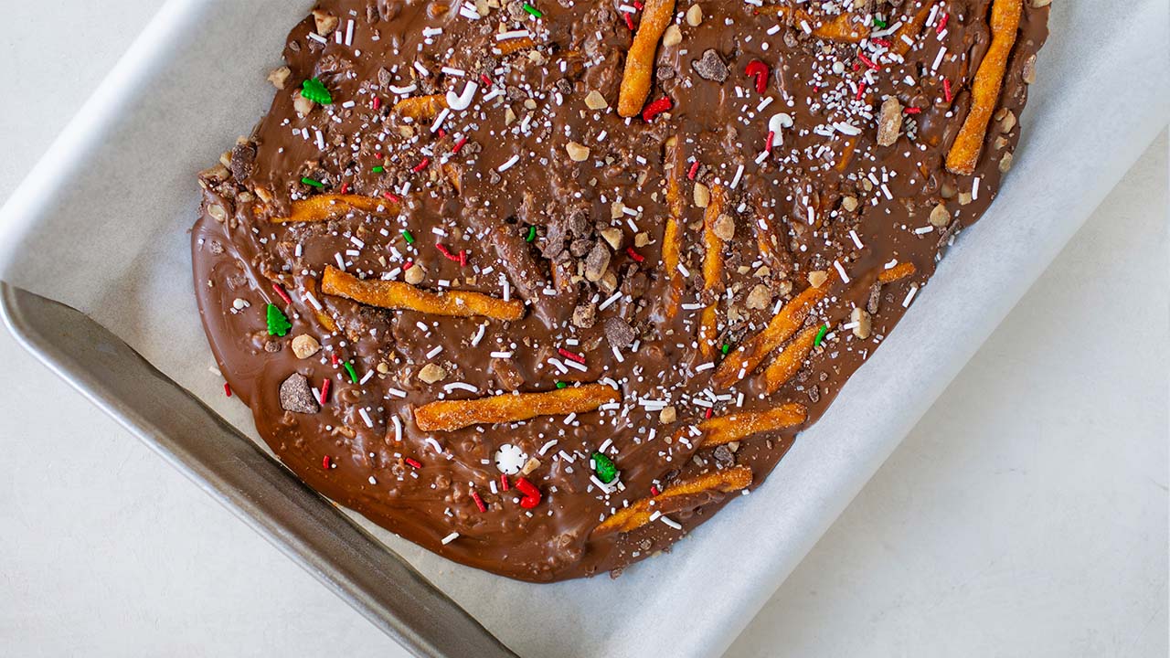 dots pretzel toffee bark cooling on a baking sheet