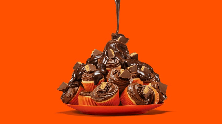 plate of piled reeses chocolate lave cupcakes