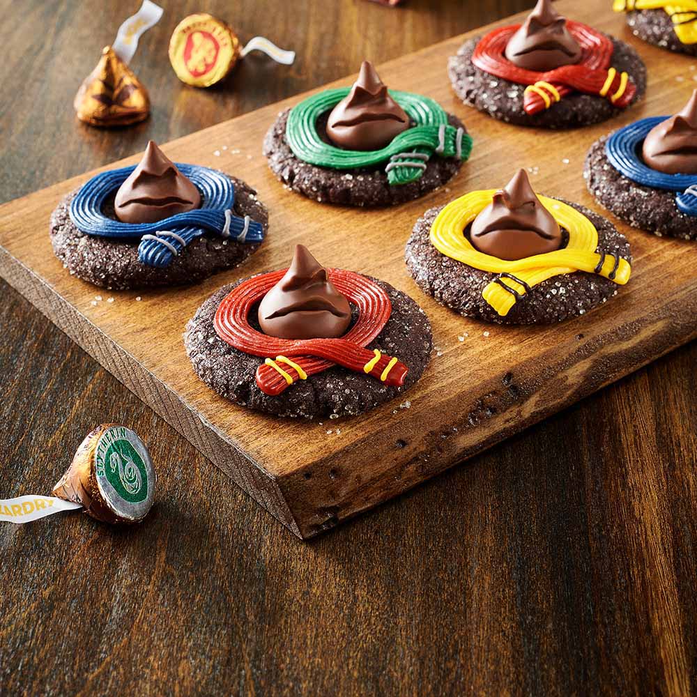 tray of freshly made harry potter house themed sorting hat cookies