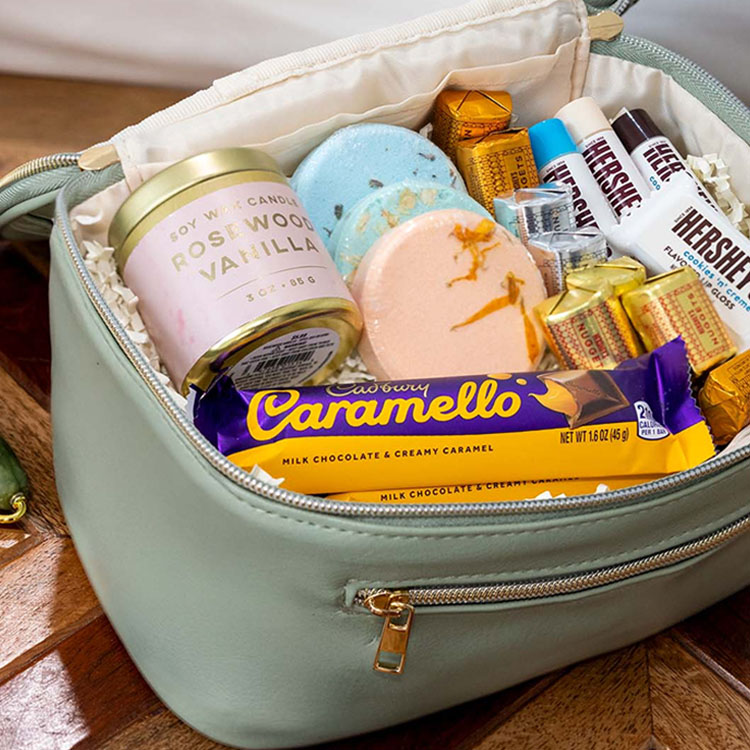 makeup bag filled with an assortment of cosmetics and hersheys candy