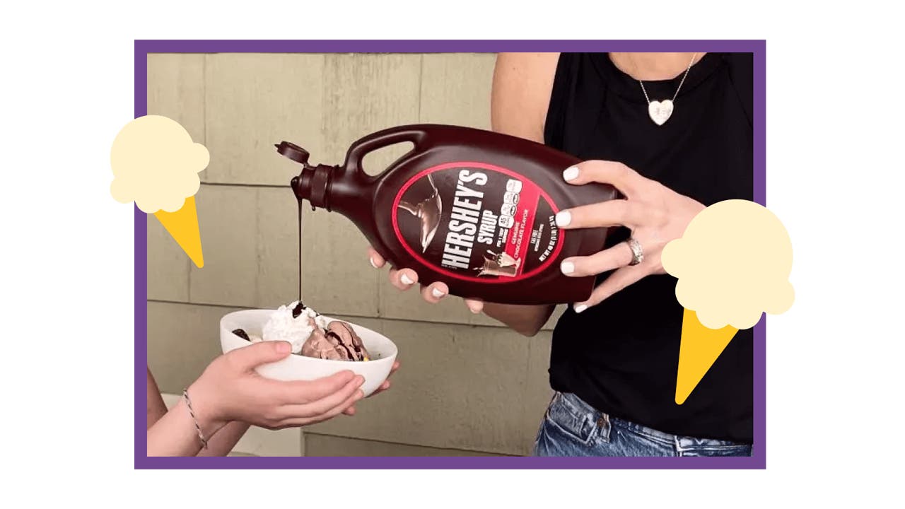 woman pouring hersheys chocolate syrup onto ice cream sundae