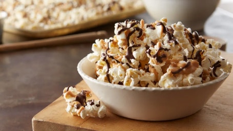 bowl of chocolate drizzled popcorn